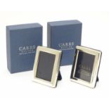 A pair of miniature photo frames of rectangular form hallmarked Sheffield 2003 maker Carrs. Each 2
