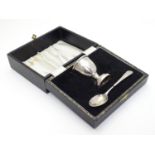 A silver christening set comprising egg cup and spoon in fitted case. Hallmarked Birmingham 1968/