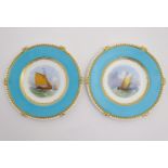 A pair of Copeland style marine dessert plates with depictions of boats at sea to the central