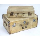 Two early 20thC vellum covered suitcases / trunks, the largest approx. 30" wide, 12" tall, 19"