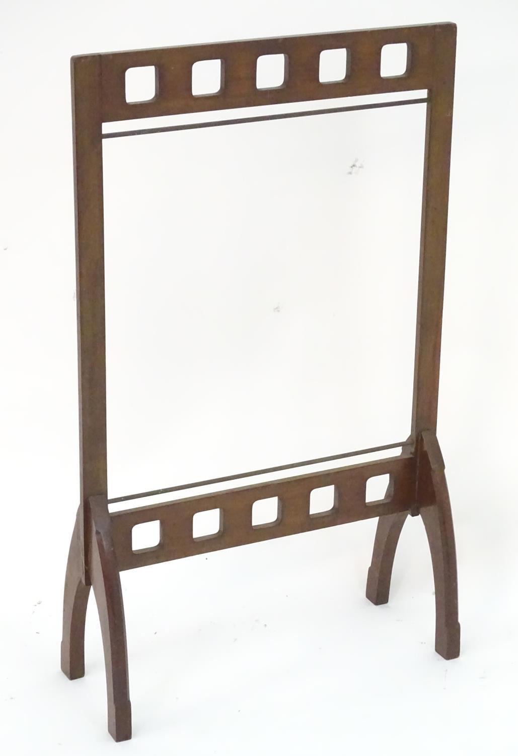 A late 19thC / early 20thC mahogany fire screen frame. In the Glasgow school style. 21" wide x 35"