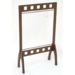 A late 19thC / early 20thC mahogany fire screen frame. In the Glasgow school style. 21" wide x 35"