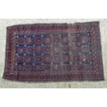 Carpet / Rug: A hand made woollen rug the blue ground detailed with geometric motiffs. Approx 59 1/