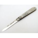A silver folding fruit knife with engraved mother of peal handle. Hallmarked Sheffield 1897 maker