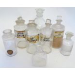 A selection of Victorian and later Chemists' glass bottles, the largest 9 1/2" tall Please Note - we