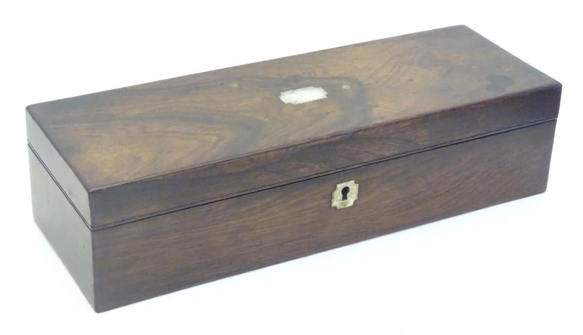 A 19thC mahogany glove box of rectangular form with inlaid mother of pearl detail. Approx. 3" x 11