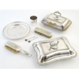 A quantity of silver plated wares to include entre dishes, hair brush, beaker etc. Please Note -