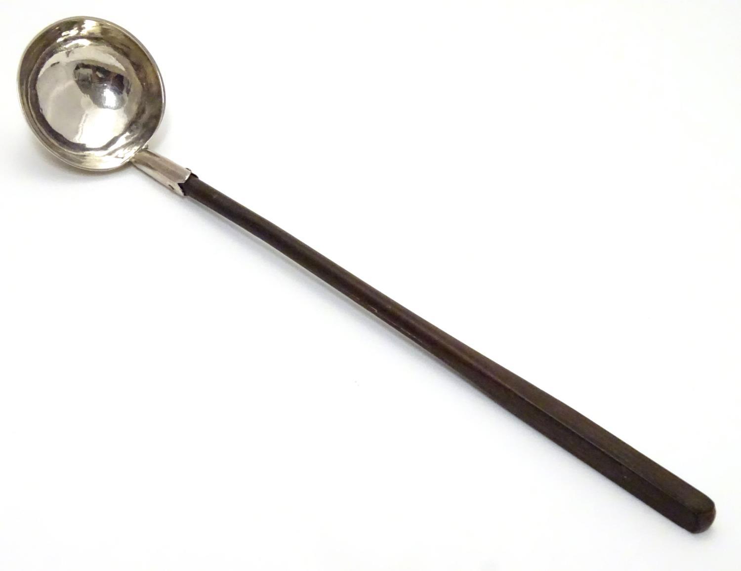 A Geo III Scottish silver ladle. 8 1/2" long overall Please Note - we do not make reference to the