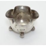 A Victorian silver salt of quatrefoil shape raised on four spherical feet. Hallmarked London 1898