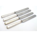 A set of four art deco silver handled tea knives. Hallmarked Sheffield 1948 maker Barker brothers