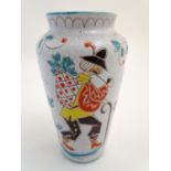 An Italian pottery vase with incised and hand painted naive decoration depicting a hiking figure