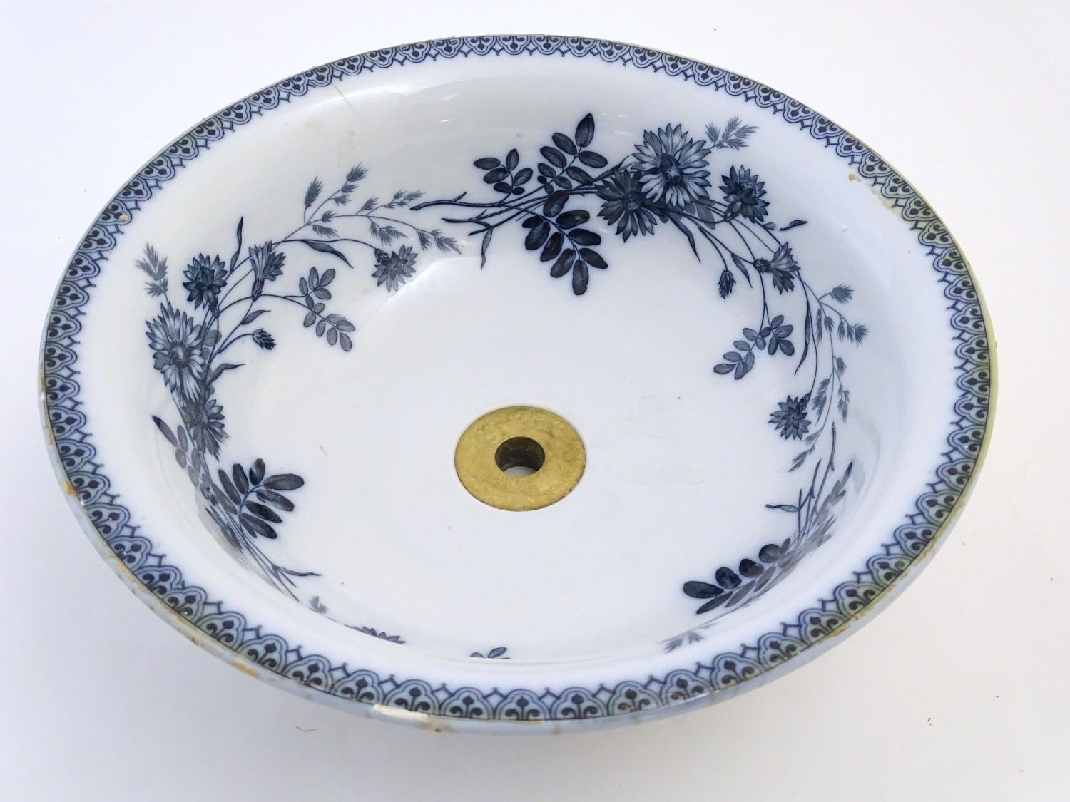 A Victorian Villeroy and Boch blue and white circular sink in the pattern Cyanus with floral and