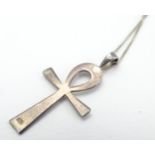 A silver celtic cross formed pendant on an 18" chain. The pendant 1" long Please Note - we do not