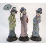 Three Lladro figures modelled as Japanese geisha girls, Oriental Spring, a girl holding a parasol,