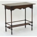 An Arts & Crafts mahogany side table in the manner of Morris & Co. with a rectangular top with a