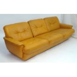 Vintage Retro, Mid-Century: a German low three seater tan leather sofa, 83" wide, 35" deep, 28 1/