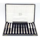 A cased set of silver handled fruit knives and forks, hallmarked Sheffield 1926, maker JS. (6+6)