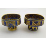 A matched pair of studio pottery footed squared bowls / pots with cobalt blue and gilt geometric
