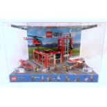 Toy: A Lego City shop display unit featuring a fire station, model no. 60004 and a fire truck, model