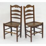 A pair of 19thC elm ladder back side chairs with turned tapering legs united by a box stretcher. 18"