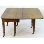 A mid 19thC mahogany extending dining table with a concertina movement and six turned turned