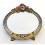 A 20thC Barbola circular easel back dressing table mirror with floral decoration in relief.