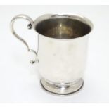 A silver christening mug hallmarked Chester with scroll handle Chester 1923 maker AW. 3" high Please