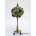 An early-20thC brass Pullman lamp, fitted with an arabesque reticulated shade having inset multi-