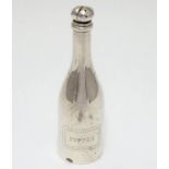An novelty white metal pepper pot formed as a bottle and titled ' pepper'. 5" high Please Note -