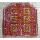 Rig / Mat : A red ground mat with two canted corners and medallion decoration. 23" x 23" Please Note