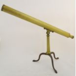 A 19thC brass two-draw telescope and removable folding tripod stand, the extended barrel measuring