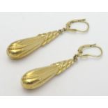 A pair of 14ct gold earrings set with ornate drops Approx 1 3/4" long Please Note - we do not make