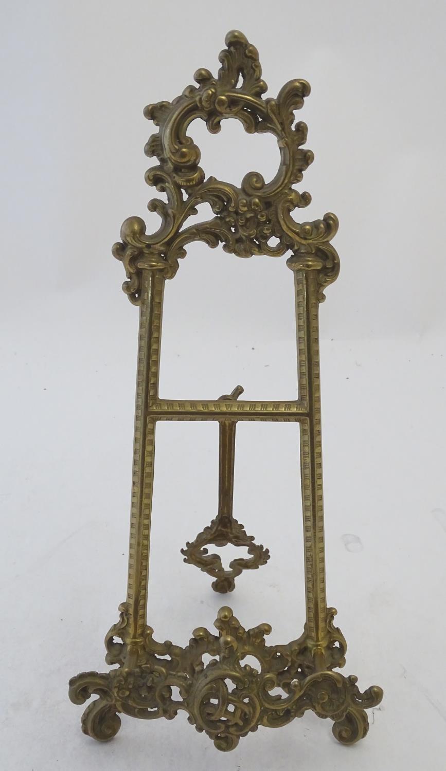 A 20thC cast brass table top easel with scrolling foliate decoration. Approx. 15 1/2" high Please