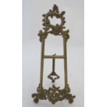 A 20thC cast brass table top easel with scrolling foliate decoration. Approx. 15 1/2" high Please