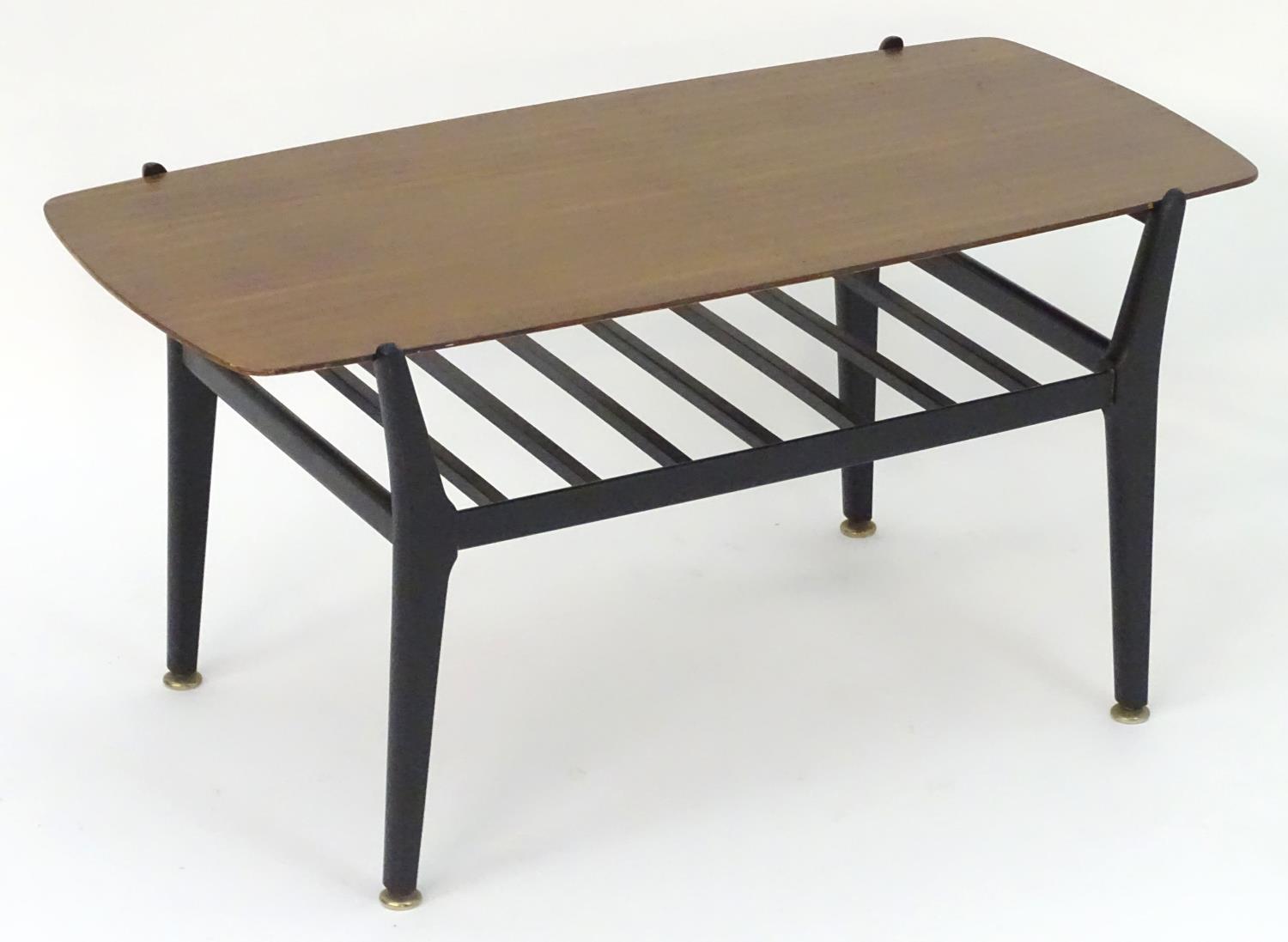 Vintage Retro, Mid-Century: a coffee table by Nathan Furniture, the teak top supported by a black