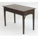 An 18thC mahogany side table with a single end drawer above a rectangular top and having brackets to