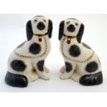 A pair of Staffordshire Ware Kent dogs, formed as spaniels, with gilt highlights. Marked under.