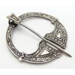 Scottish Silver : A Scottish penannular brooch with celtic decoration. Hallmarked Glasgow 1947 maker