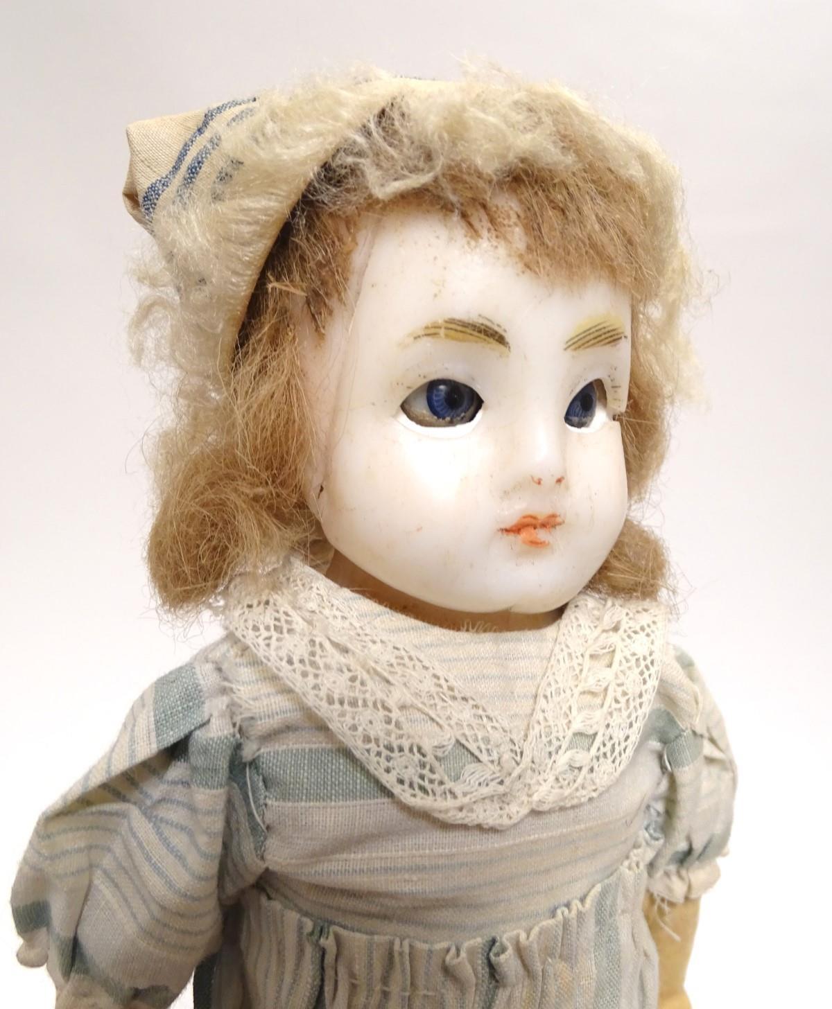 Toy: A wax headed doll with blue eyes, painted features, brown hair, composite forearms and - Image 7 of 9