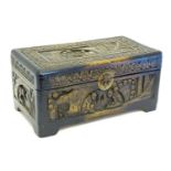 An early 20thC Oriental hand carved box, decorated with figures with a floral border. Approx. 6 1/2"