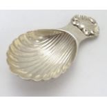 A silver caddy spoon with shell formed bowl. hallmarked Birmingham 1966 maker S J Rose & Son. Approx