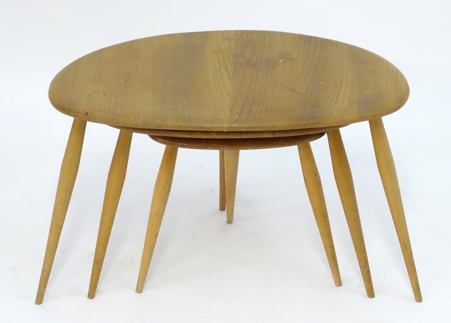 Vintage Retro, Mid-Century: an Ercol elm and beech graduated nest of three tripod tables, the - Image 4 of 4