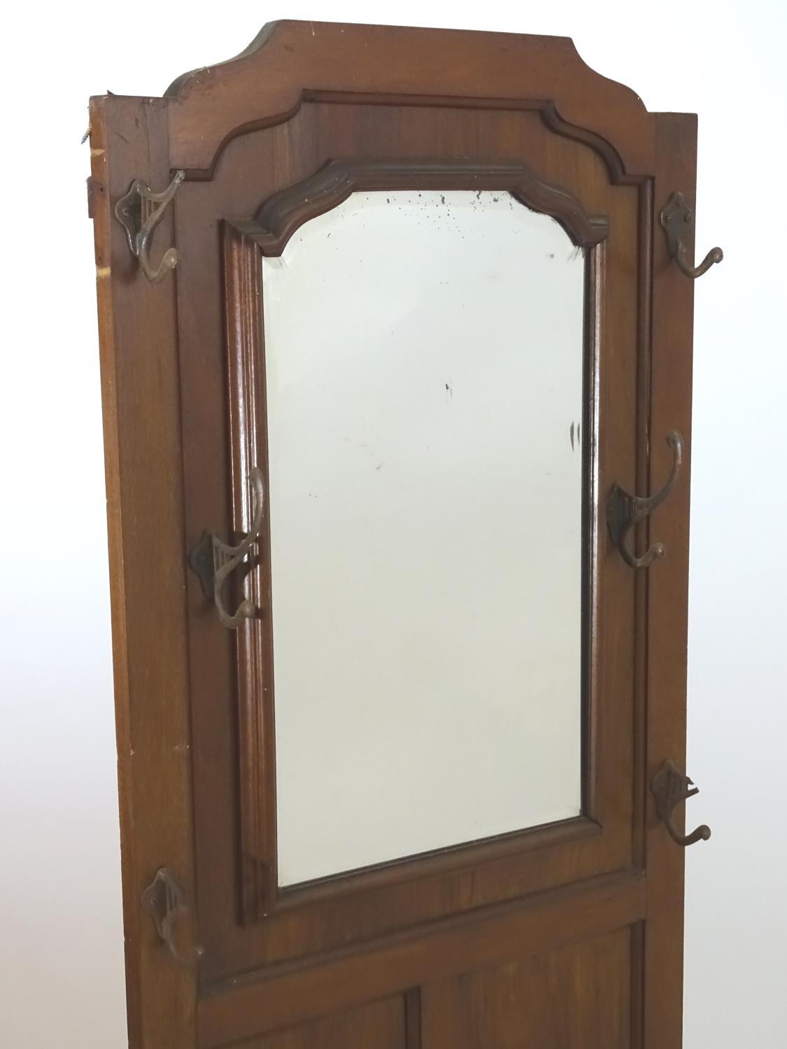 An early 20thC mahogany hall stand with a central bevelled mirror surrounded by ogee mouldings, - Image 4 of 4
