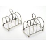 Two silver4-bar toast racks hallmarked Chester 1909 / 1911 maker Haseler Brothers (Edward John