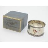 A Silver napkin ring with enamel depiction of a shipping line flag upon, possibly the Elder Dempster
