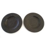 A pair of Chinese bronze plates / chargers with engraved / incised decoration, the centre