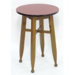 Vintage Retro, Mid-Century: a circular occasional table, the base consisting of four carved beech