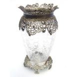 A rock crystal vase of lobed baluster form with cut floral decoration with associated silver