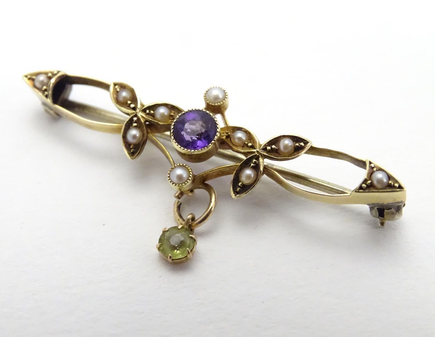 Suffragette jewellery : An early 20thC 15ct gold brooch set with amethyst, seed pearls and peridot ( - Image 3 of 5