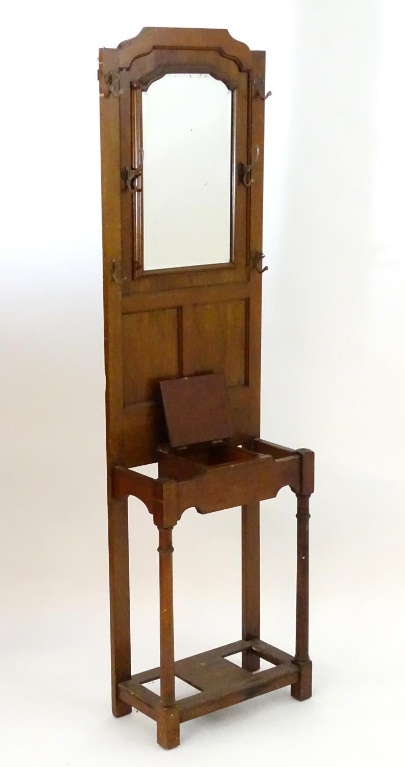 An early 20thC mahogany hall stand with a central bevelled mirror surrounded by ogee mouldings, - Image 3 of 4